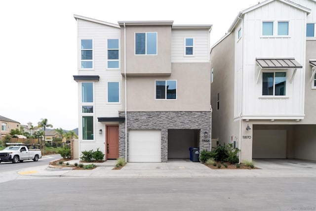 townhome / multi-family property featuring a garage