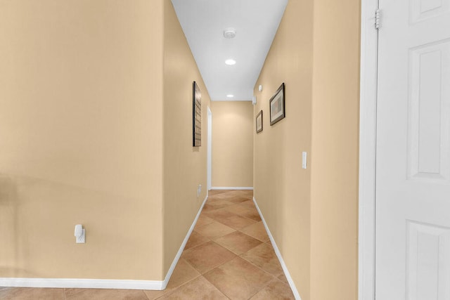 corridor featuring light tile patterned floors