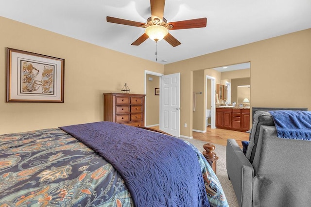 bedroom featuring ceiling fan, connected bathroom, and light tile patterned flooring