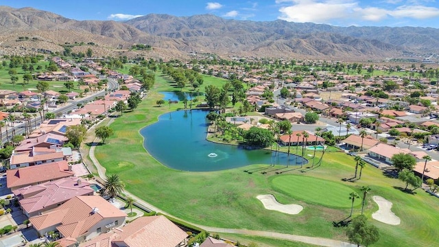 bird's eye view with a water and mountain view