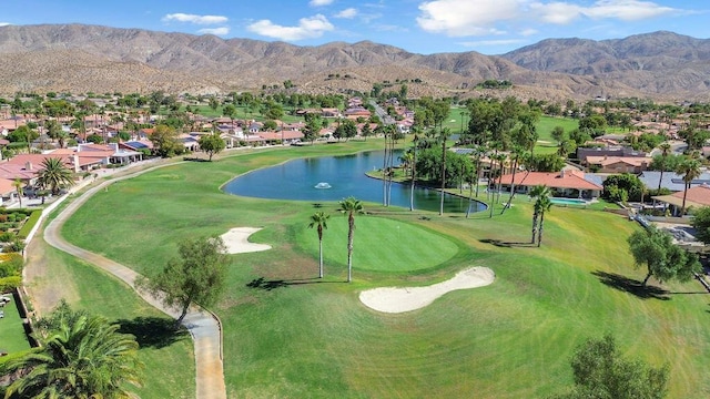 bird's eye view with a water and mountain view