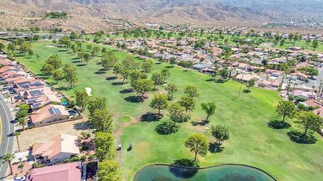 birds eye view of property with a water and mountain view