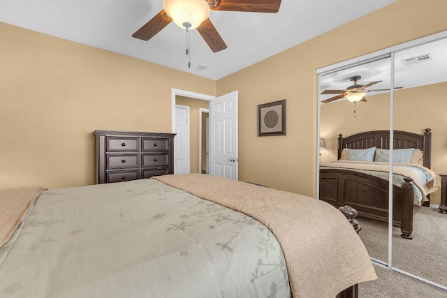 bedroom with ceiling fan, a closet, and carpet floors