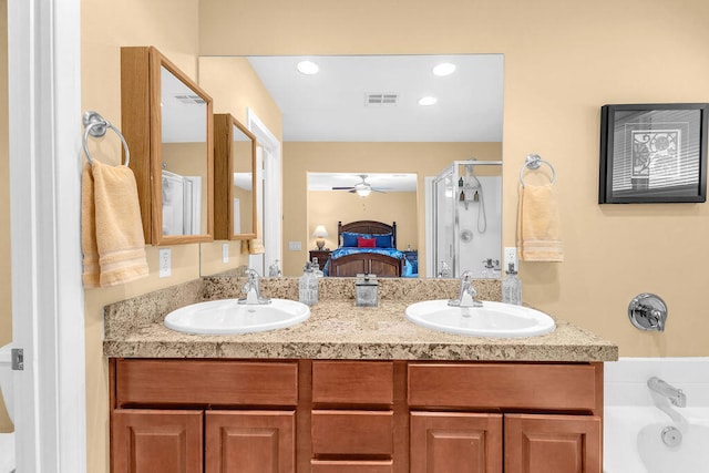 bathroom featuring ceiling fan, vanity, and separate shower and tub