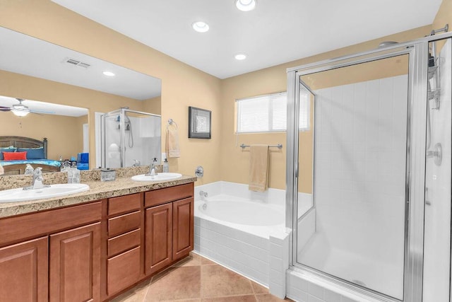 bathroom featuring ceiling fan, vanity, separate shower and tub, and tile patterned flooring