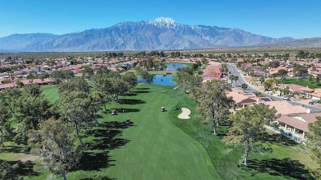 drone / aerial view featuring a water and mountain view