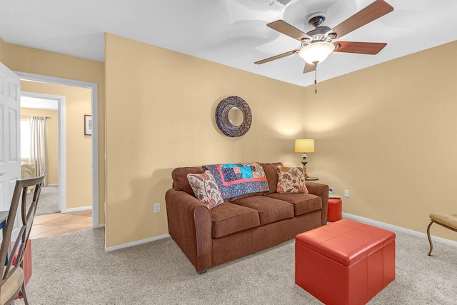 living room with ceiling fan and light carpet