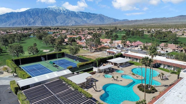 birds eye view of property featuring a mountain view