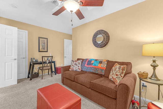 carpeted living room featuring ceiling fan