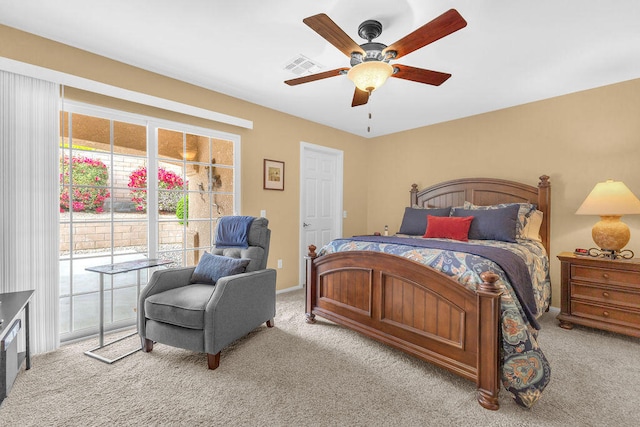 bedroom featuring ceiling fan and light carpet