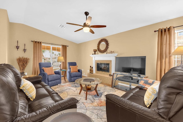 living room with ceiling fan and vaulted ceiling