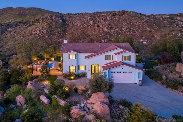 birds eye view of property with a mountain view