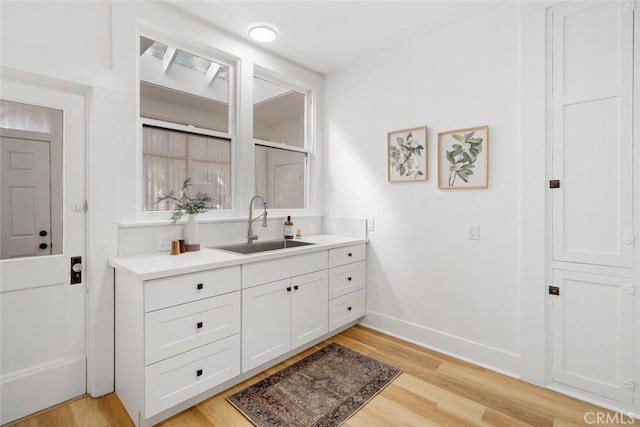 bathroom featuring hardwood / wood-style floors and vanity