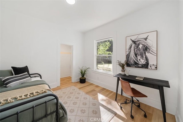 bedroom with light wood-type flooring