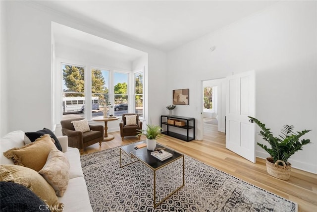 living room featuring a wealth of natural light and hardwood / wood-style flooring