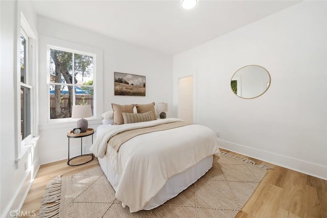 bedroom with light hardwood / wood-style flooring