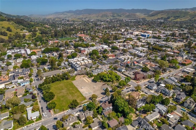 birds eye view of property with a mountain view