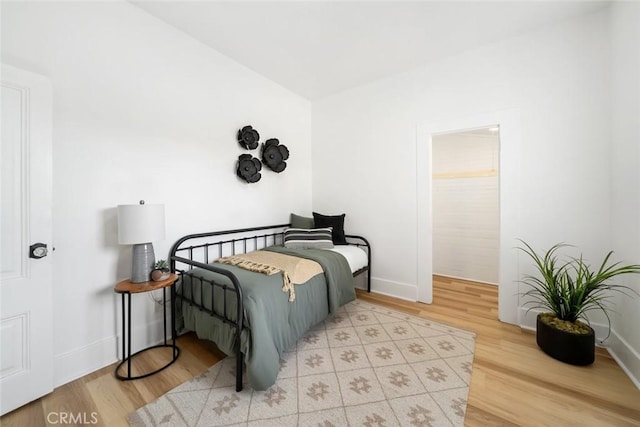 bedroom with light wood-type flooring