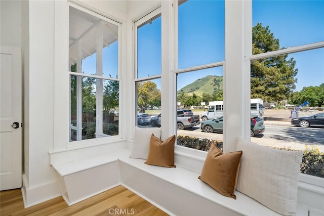 sunroom with a mountain view