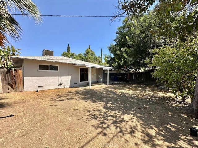 rear view of house with cooling unit