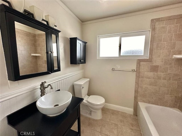 full bathroom with toilet, tiled shower / bath combo, tile patterned flooring, crown molding, and vanity