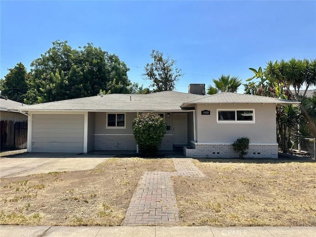 single story home featuring a garage