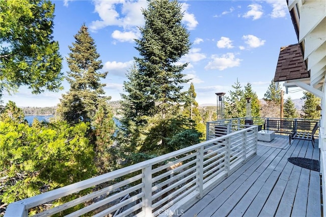 wooden terrace with a water view