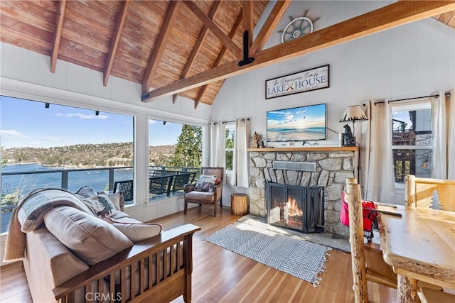 347 Emerald Dr, Lake Arrowhead, CA 92352 - living area featuring hardwood / wood-style floors, a wood ceiling with exposed beams, a fireplace, high vaulted ceiling, and a water view
