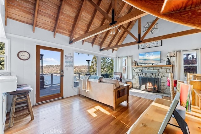 347 Emerald Dr, Lake Arrowhead, CA 92352 - living room featuring a wooden ceiling with exposed beams, hardwood / wood-style flooring, a stone fireplace, and high vaulted ceiling