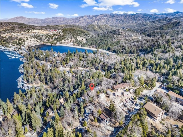 aerial view featuring a water and mountain view