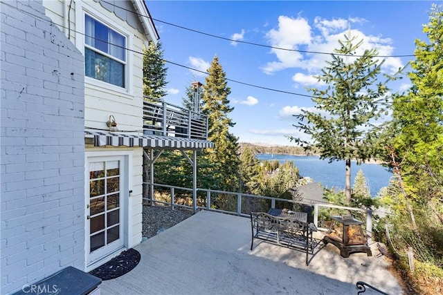 view of patio / terrace featuring a water view