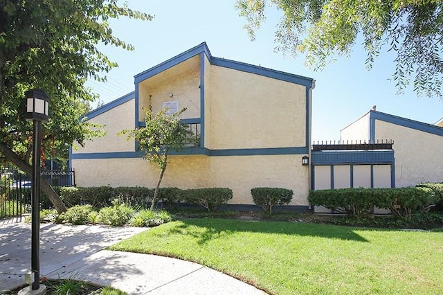 view of side of home featuring a lawn