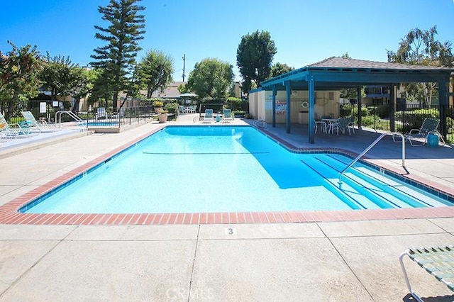 view of swimming pool with a patio