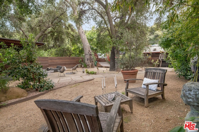 view of patio / terrace featuring a fire pit