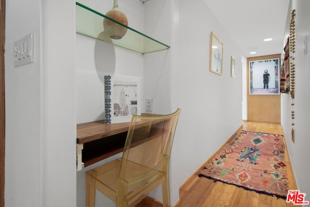 hallway featuring hardwood / wood-style flooring