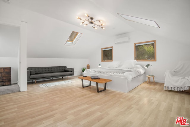 living room featuring a wall mounted AC, lofted ceiling with skylight, and light hardwood / wood-style flooring