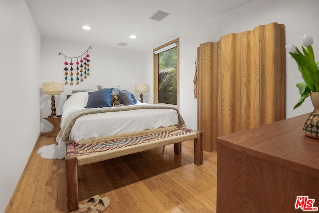 bedroom with light hardwood / wood-style flooring