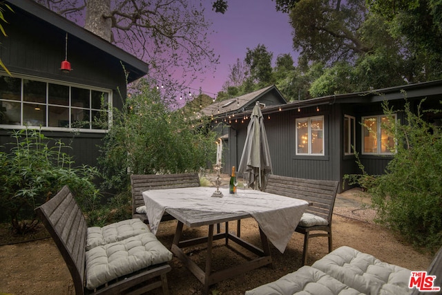 view of patio terrace at dusk