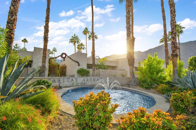 view of swimming pool featuring a mountain view