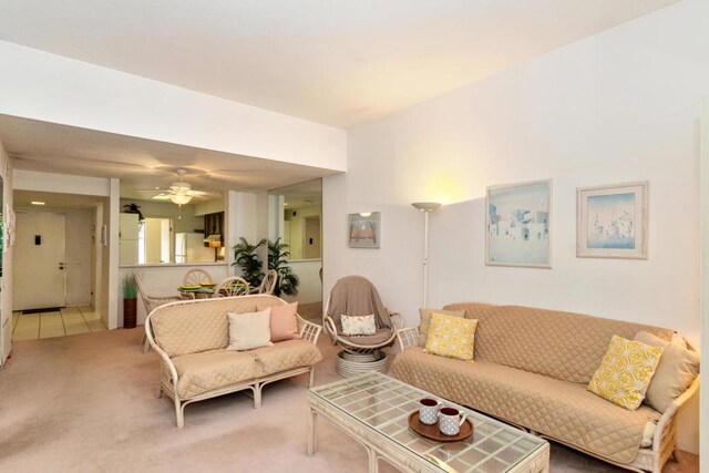 living room featuring ceiling fan and carpet