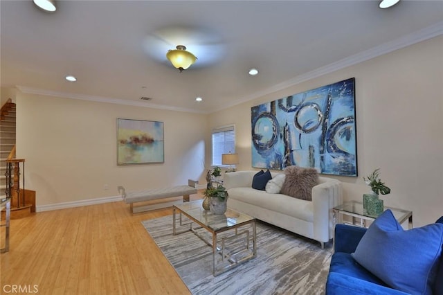 living room featuring ornamental molding and hardwood / wood-style flooring