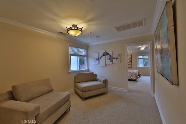 living area with light colored carpet and ornamental molding