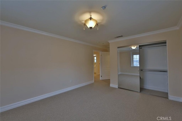 unfurnished bedroom featuring a closet and crown molding