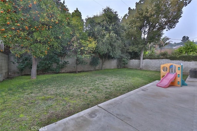 view of yard with a patio area and a playground