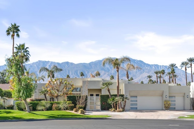 view of front of house with a mountain view and a garage