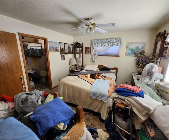 bedroom featuring ceiling fan and a textured ceiling