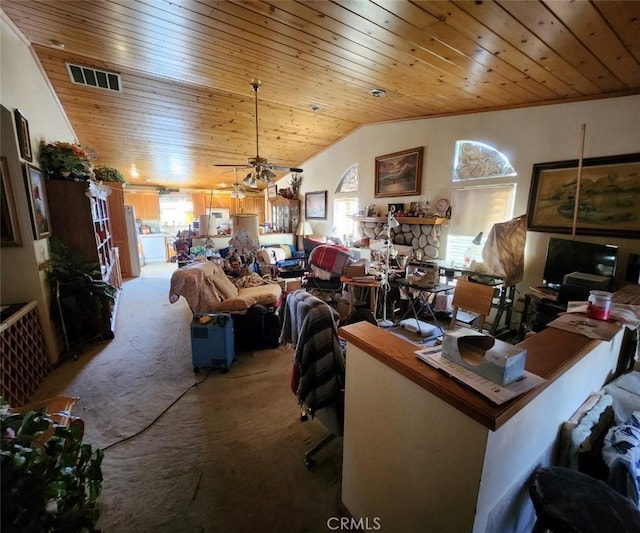 office area with a healthy amount of sunlight, vaulted ceiling, carpet flooring, and wooden ceiling