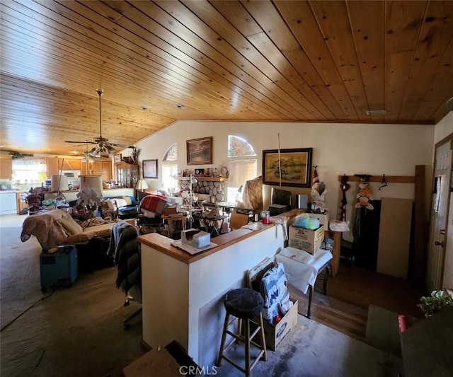 interior space with lofted ceiling, wood ceiling, carpet floors, and ceiling fan