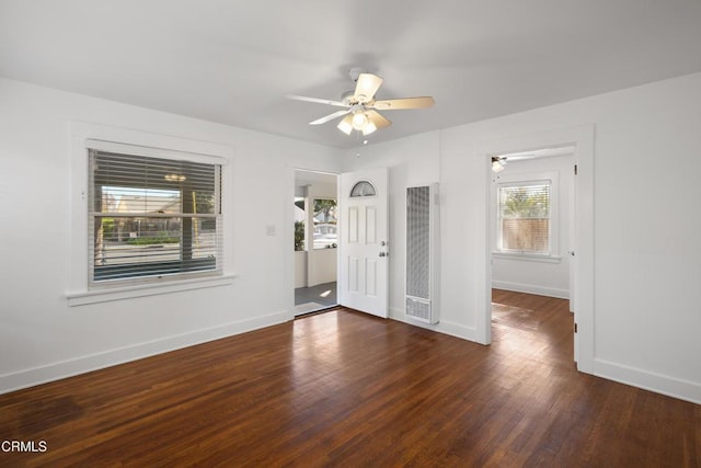 unfurnished room featuring ceiling fan and dark hardwood / wood-style flooring