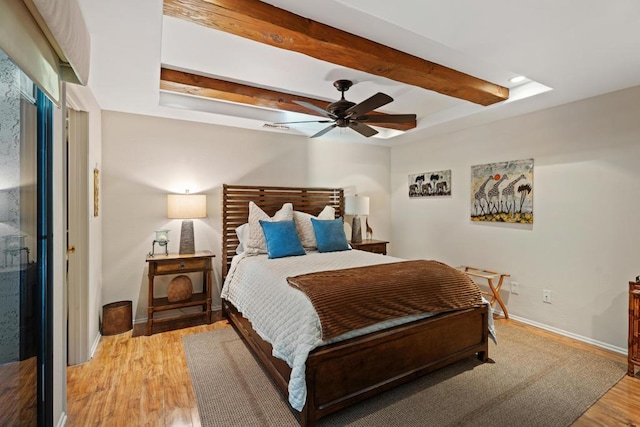 bedroom with ceiling fan and light hardwood / wood-style flooring